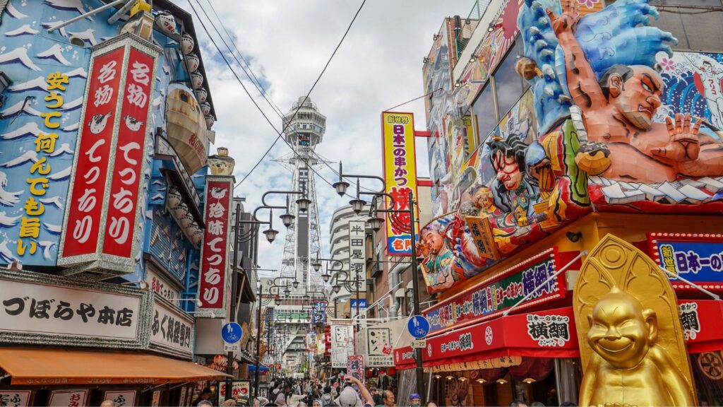 Japanese street with shops and tall tower